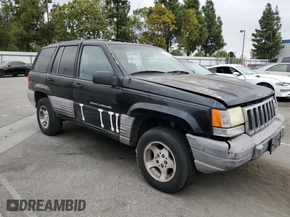 1998 Jeep Grand Cherokee Laredo with VIN 1J4FX58S0WC305329, listed as a Copart auction lot 76777264 with 251,942 mi miles and Clean Title. Bid and sale history available at carsss.com. Image 4.