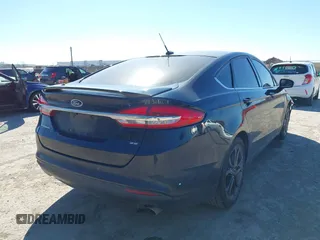 2018 Ford Fusion SE z VIN 3FA6P0H77JR180057, wystawiony jako IAAI lot #41729451 z przebiegiem 122 200 mil mil oraz . Historia ofert i sprzedaży dostępna na DreamBid. Obrazek 4.