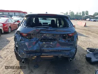 2024 Mazda CX-50 S Premium z VIN 7MMVABDM7RN231991, wystawiony jako IAAI lot #42481427 z przebiegiem 7 843 mil mil oraz . Historia ofert i sprzedaży dostępna na DreamBid. Obrazek 17.