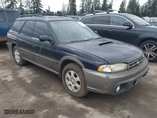 1999 Subaru Legacy Wagon Outback with VIN 4S3BG6850X7660015, listed as a IAAI auction lot 41783811 with 156,093 mi miles. Bid and sale history available at carsss.com. Image 1.