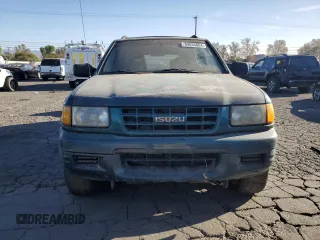 1999 Isuzu Rodeo S with VIN 4S2CK58W1X4349947, listed as a Copart auction lot 84634064 with 135,851 mi miles and Clean Title. Bid and sale history available at DreamBid. Image 5.