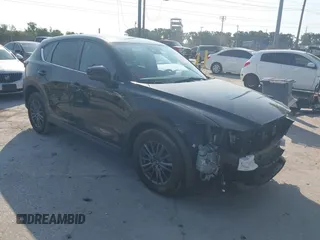 2020 Mazda CX-5 Touring with VIN JM3KFACM2L0770241, listed as a IAAI auction lot 42186952 with 41,590 mi miles and . Bid and sale history available at DreamBid. Image 1.