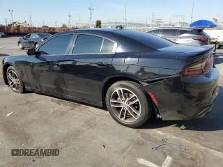 2019 Dodge Charger SXT with VIN 2C3CDXJG8KH757818, listed as a Copart auction lot 49518475 with 98,129 mi miles and Salvage Title. Bid and sale history available at DreamBid. Image 2.