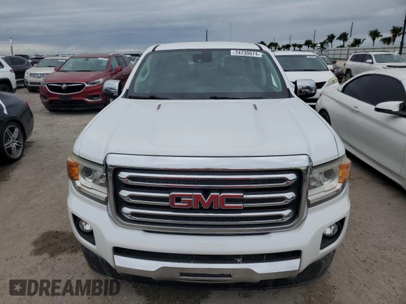 2017 GMC Canyon 2WD SLT z VIN 1GTG5DE13H1235684, wystawiony jako Copart lot #74739974 z przebiegiem Nie podano mil oraz Szkoda całkowita • Salvage title. Historia ofert i sprzedaży dostępna na DreamBid. Obrazek 5.