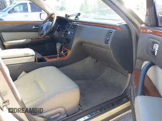 2001 Infiniti Q45 Touring z VIN JNKBY31A41M100704, wystawiony jako IAAI lot #42346520 z przebiegiem 73 073 mil mil oraz . Historia ofert i sprzedaży dostępna na DreamBid. Obrazek 5.