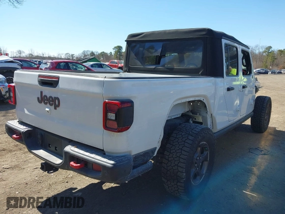 2020 Jeep Gladiator Rubicon with VIN 1C6JJTBG1LL181875, listed as a IAAI auction lot 41722037 with 51,037 mi miles and . Bid and sale history available at DreamBid. Image 4.