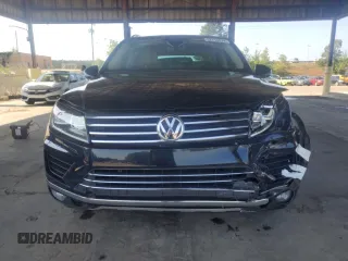 2017 Volkswagen Touareg Sport with VIN WVGEF7BP8HD000237, listed as a Copart auction lot 52714074 with 107,463 mi miles and . Bid and sale history available at DreamBid. Image 5.