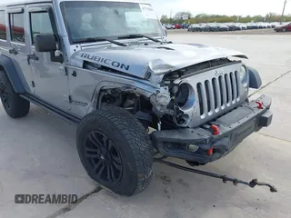 2015 Jeep Wrangler Unlimited Rubicon Hard Rock с VIN 1C4HJWFG6FL762537, выставлен на аукционе IAAI как лот 41792066 с пробегом 125 829 миль миль и . История ставок и продаж доступна на DreamBid. Изображение 6.