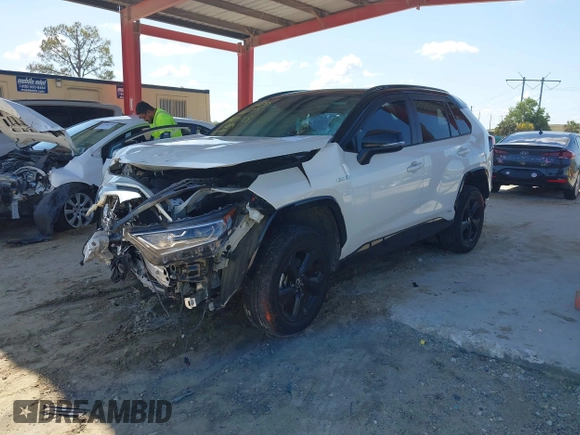 2021 Toyota RAV4 Hybrid XSE with VIN 2T3E6RFV9MW019837, listed as a IAAI auction lot 42002574 with 74,214 mi miles. Bid and sale history available at carsss.com. Image 18.