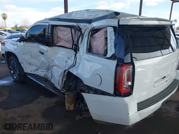 2019 GMC Yukon SLT with VIN 1GKS2BKC5KR109529, listed as a IAAI auction lot 41559860 with 136,025 mi miles. Bid and sale history available at carsss.com. Image 3.