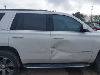 2019 GMC Yukon SLT with VIN 1GKS1BKCXKR329607, listed as a IAAI auction lot 41188239 with 84,940 mi miles. Bid and sale history available at carsss.com. Image 13.
