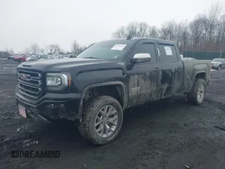 2018 GMC Sierra 1500 SLE z VIN 3GTU2MEC8JG249701, wystawiony jako IAAI lot #41556135 z przebiegiem 87 657 mil mil oraz . Historia ofert i sprzedaży dostępna na DreamBid. Obrazek 2.