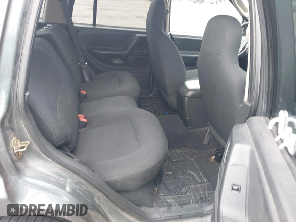 2003 Jeep Grand Cherokee Laredo with VIN 1J4GX48S03C536709, listed as a IAAI auction lot 41908946 with 240,435 mi miles. Bid and sale history available at carsss.com. Image 8.