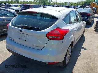 2018 Ford Focus Titanium with VIN 1FADP3N24JL279449, listed as a IAAI auction lot 42297780 with 144,479 mi miles and . Bid and sale history available at DreamBid. Image 4.