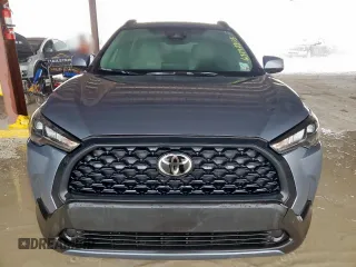 2023 Toyota Corolla Cross LE with VIN 7MUBAAAG4PV042580, listed as a Copart auction lot 63797305 with 59,576 mi miles and Salvage title. Bid and sale history available at DreamBid. Image 5.