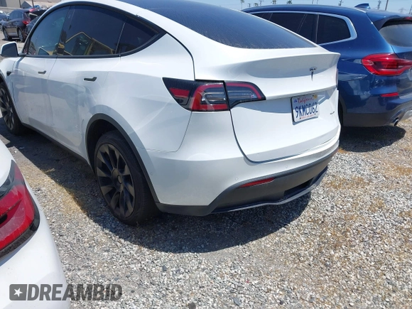 2022 Tesla Model Y Long Range with VIN 7SAYGDEE8NF480939, listed as a IAAI auction lot 41808863 with 62,607 mi miles and . Bid and sale history available at carsss.com. Image 3.