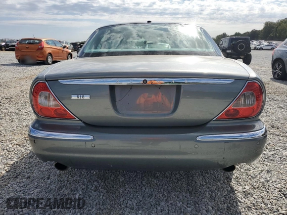 2006 Jaguar XJ with VIN SAJWA71B06SH03941, listed as a Copart auction lot 76013984 with 0 mi miles and Salvage Title. Bid and sale history available at carsss.com. Image 6.