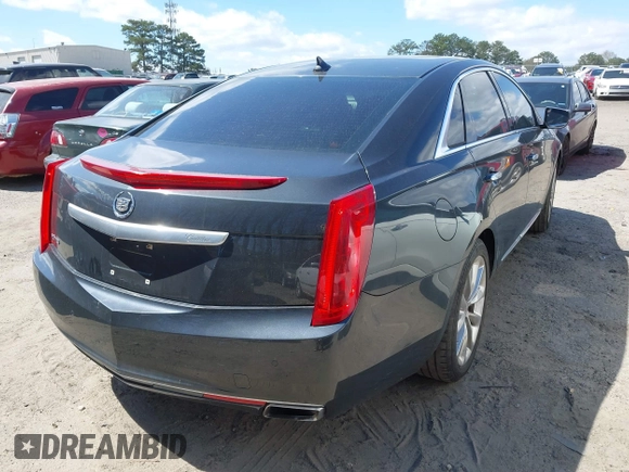 2013 Cadillac XTS Premium with VIN 2G61S5S33D9113653, listed as a IAAI auction lot 41837117 with 101,049 mi miles and . Bid and sale history available at DreamBid. Image 4.