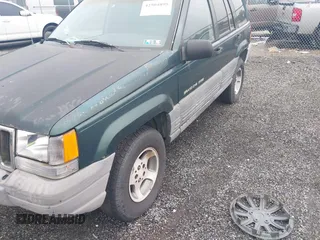 1996 Jeep Grand Cherokee Laredo with VIN 1J4GZ58S6TC333856, listed as a IAAI auction lot 42504895 with 176,955 mi miles and . Bid and sale history available at DreamBid. Image 6.