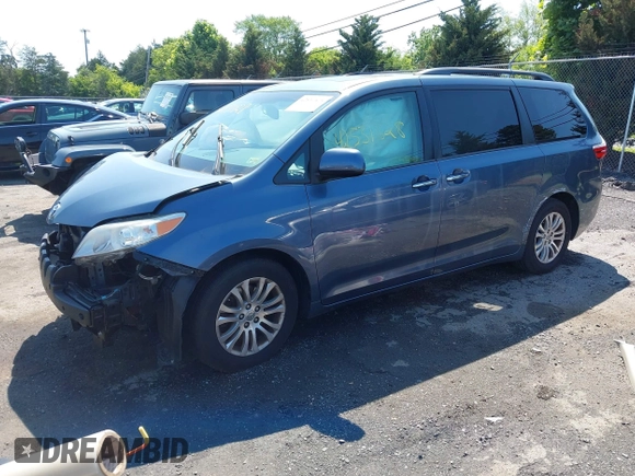 2015 Toyota Sienna XLE with VIN 5TDYK3DC0FS649998, listed as a IAAI auction lot 42531828 with 111,539 mi miles and . Bid and sale history available at DreamBid. Image 2.