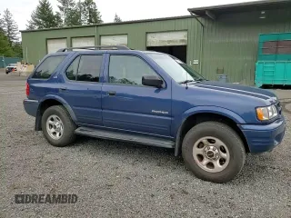 2002 Isuzu Rodeo S with VIN 4S2CK58W124301647, listed as a Copart auction lot 56973895 with 129,009 mi miles and Salvage title. Bid and sale history available at DreamBid. Image 14.