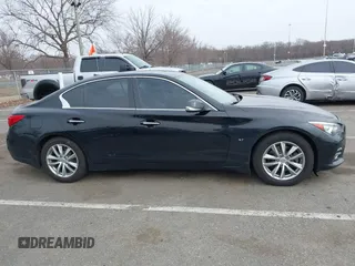 2015 Infiniti Q50 z VIN JN1BV7AR6FM412573, wystawiony jako IAAI lot #41796802 z przebiegiem 136 410 mil mil oraz . Historia ofert i sprzedaży dostępna na DreamBid. Obrazek 13.