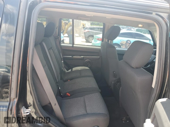 2008 Jeep Commander Sport z VIN 1J8HH48K58C126172, wystawiony jako Copart lot #61961285 z przebiegiem 235 022 mil mil oraz Szkoda całkowita • Salvage title. Historia ofert i sprzedaży dostępna na DreamBid. Obrazek 10.