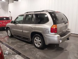 2003 GMC Envoy SLT with VIN 1GKDT13S932395367, listed as a IAAI auction lot 41544810 with 142,012 mi miles. Bid and sale history available at carsss.com. Image 3.