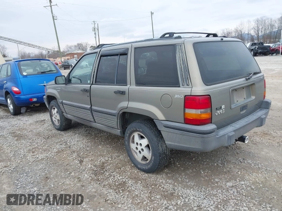 1995 Jeep Grand Cherokee Laredo with VIN 1J4GZ58S4SC555309, listed as a IAAI auction lot 41600141 with 130,493 mi miles. Bid and sale history available at carsss.com. Image 3.