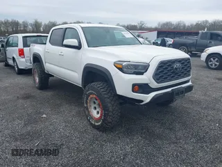 2023 Toyota Tacoma SR z VIN 3TMCZ5AN2PM641846, wystawiony jako IAAI lot #41948660 z przebiegiem 21 969 mil mil oraz . Historia ofert i sprzedaży dostępna na DreamBid. Obrazek 1.