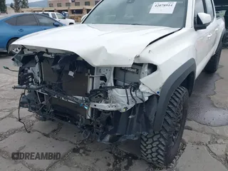2021 Toyota Tacoma SR5 z VIN 3TMDZ5BN2MM100245, wystawiony jako IAAI lot #42078914 z przebiegiem 58 153 mil mil oraz . Historia ofert i sprzedaży dostępna na DreamBid. Obrazek 6.