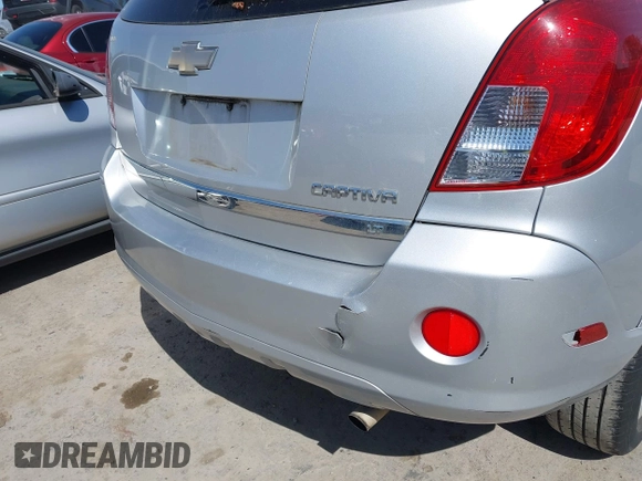 2013 Chevrolet Captiva Sport LT z VIN 3GNAL3EK5DS637043, wystawiony jako IAAI lot #42089008 z przebiegiem 170 556 mil mil oraz . Historia ofert i sprzedaży dostępna na DreamBid. Obrazek 12.