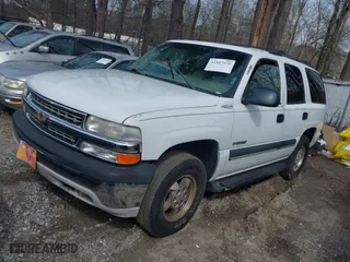 2003 Chevrolet Tahoe LT with VIN 1GNEC13Z33J145665, listed as a IAAI auction lot 41807970 with 307,997 mi miles. Bid and sale history available at carsss.com. Image 2.