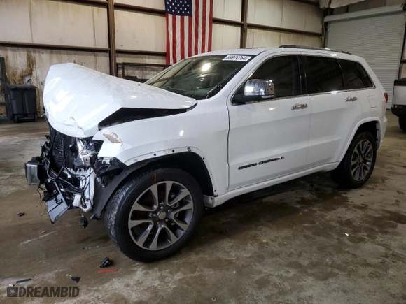 2017 Jeep Grand Cherokee Overland with VIN 1C4RJECG9HC965752, listed as a Copart auction lot 83874784 with 106,604 mi miles and Salvage Title. Bid and sale history available at carsss.com. Image 1.