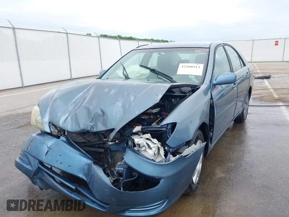2002 Toyota Camry LE z VIN 4T1BE32KX2U617732, wystawiony jako IAAI lot #42208913 z przebiegiem Nie podano mil oraz . Historia ofert i sprzedaży dostępna na DreamBid. Obrazek 6.