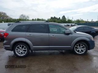 2012 Dodge Journey Crew z VIN 3C4PDCDG9CT146593, wystawiony jako IAAI lot #42127303 z przebiegiem 137 861 mil mil oraz . Historia ofert i sprzedaży dostępna na DreamBid. Obrazek 14.
