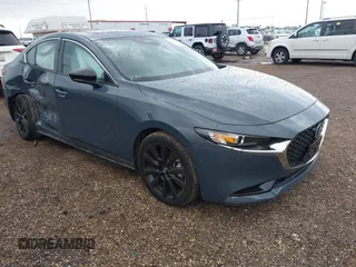 2025 Mazda 3 S Carbon Edition with VIN 3MZBPBCM5SM469953, listed as a IAAI auction lot 42358717 with 977 mi miles and . Bid and sale history available at DreamBid. Image 1.