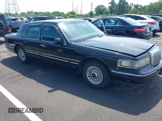 1997 Lincoln Town Car Executive z VIN 1LNLM81W4VY639019, wystawiony jako IAAI lot #42538467 z przebiegiem 308 354 mil mil oraz . Historia ofert i sprzedaży dostępna na DreamBid. Obrazek 1.