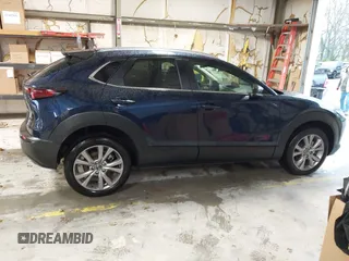 2022 Mazda CX-30 S Select z VIN 3MVDMBBL0NM440747, wystawiony jako IAAI lot #41864038 z przebiegiem 9667 mil mil oraz . Historia ofert i sprzedaży dostępna na DreamBid. Obrazek 13.