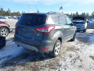2016 Ford Escape SE with VIN 1FMCU9GX1GUC32307, listed as a IAAI auction lot 41395399 with 142,664 mi miles. Bid and sale history available at carsss.com. Image 4.