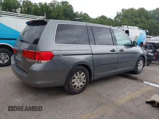 2009 Honda Odyssey LX with VIN 5FNRL38269B043326, listed as a IAAI auction lot 42872714 with 235,087 mi miles and . Bid and sale history available at DreamBid. Image 4.