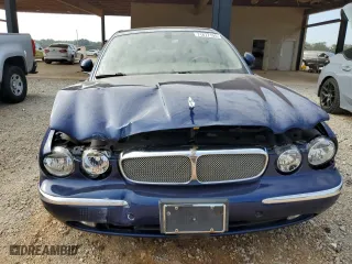 2004 Jaguar XJ with VIN SAJWA71C34SG19800, listed as a Copart auction lot 71877194 with 157,051 mi miles and Salvage Title. Bid and sale history available at carsss.com. Image 5.