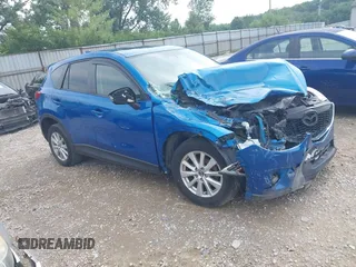2014 Mazda CX-5 Touring with VIN JM3KE2CY8E0315778, listed as a IAAI auction lot 42796668 with 160,125 mi miles and . Bid and sale history available at DreamBid. Image 1.
