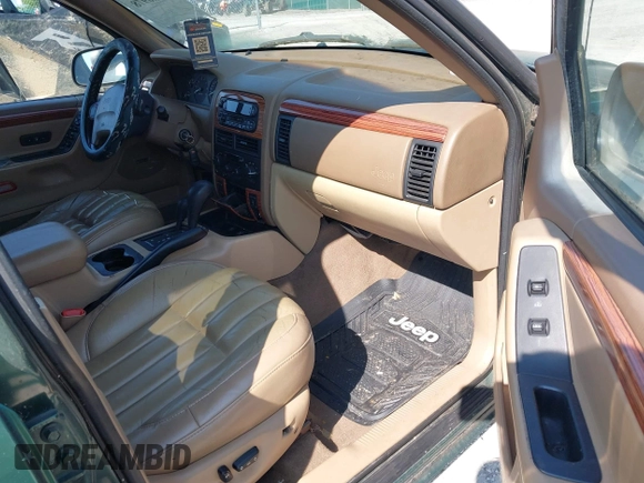 1999 Jeep Grand Cherokee Limited z VIN 1J4GW68N5XC630910, wystawiony jako IAAI lot #42380978 z przebiegiem 188 300 mil mil oraz . Historia ofert i sprzedaży dostępna na DreamBid. Obrazek 5.