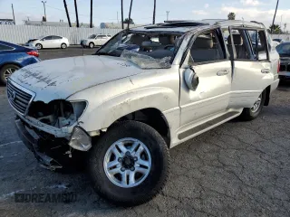 1999 Lexus LX 470 with VIN JT6HT00W0X0074678, listed as a Copart auction lot 89012595 with Not Provided miles and Salvage Title. Bid and sale history available at DreamBid. Image 1.