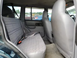 1998 Jeep Cherokee Sport z VIN 1J4FJ68S4WL101110, wystawiony jako Copart lot #57696755 z przebiegiem 218 254 mil mil oraz Szkoda całkowita • Salvage title. Historia ofert i sprzedaży dostępna na DreamBid. Obrazek 11.