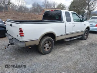 1999 Ford F-150 XL with VIN 1FTRX18LXXKA75357, listed as a IAAI auction lot 41630371 with 202,021 mi miles. Bid and sale history available at carsss.com. Image 4.