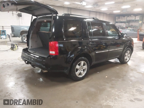 2012 Honda Pilot Touring with VIN 5FNYF4H91CB067014, listed as a IAAI auction lot 41749402 with 151,248 mi miles. Bid and sale history available at carsss.com. Image 4.