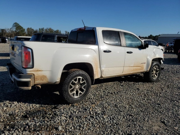 2021 GMC Canyon 4WD AT4 w/Cloth with VIN 1GTG6FEN9M1216062, listed as a Copart auction lot 80932634 with 73,308 mi miles and Salvage Title. Bid and sale history available at carsss.com. Image 3.