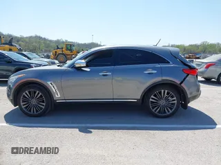 2015 Infiniti QX70 with VIN JN8CS1MW1FM481233, listed as a IAAI auction lot 41976458 with 134,875 mi miles and . Bid and sale history available at DreamBid. Image 14.